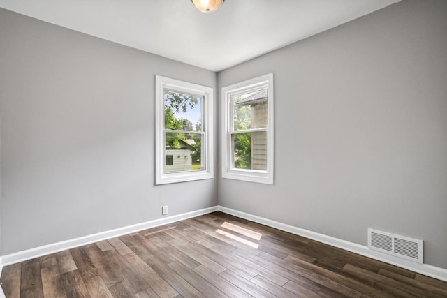 4636 N 19th St, Milwaukee, WI 53209 - empty room featuring baseboards and dark wood-style floors