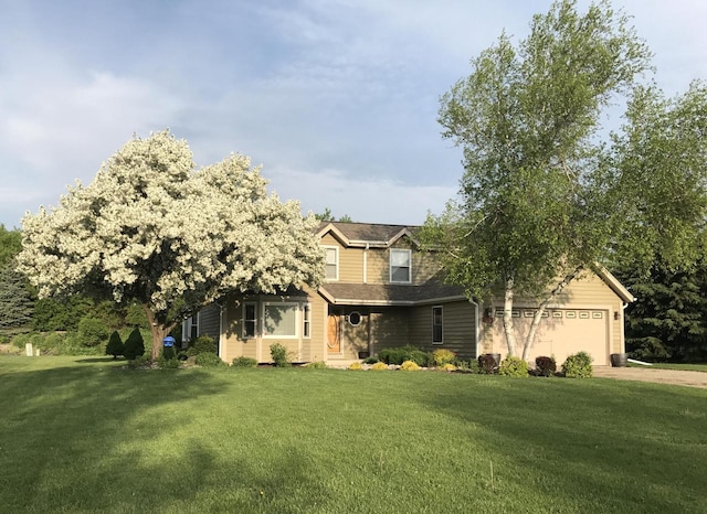 W227N2527 Meadowood Ln, Waukesha, WI 53186 - view of front facade featuring a front yard, a garage, and concrete driveway
