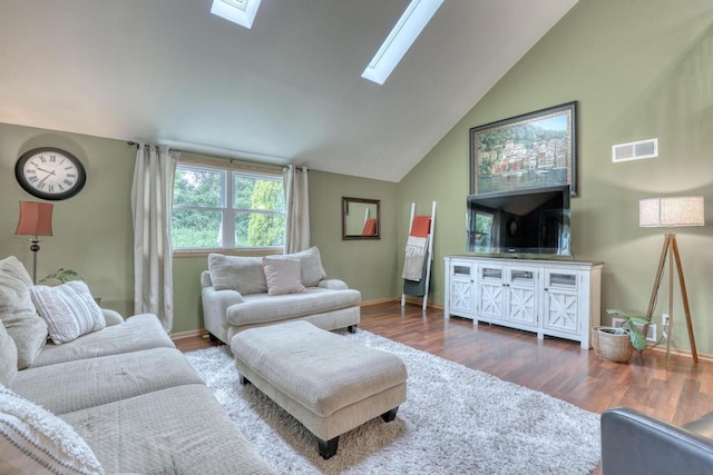 W227N2527 Meadowood Ln, Waukesha, WI 53186 - living area featuring a skylight, lofted ceiling, and wood finished floors