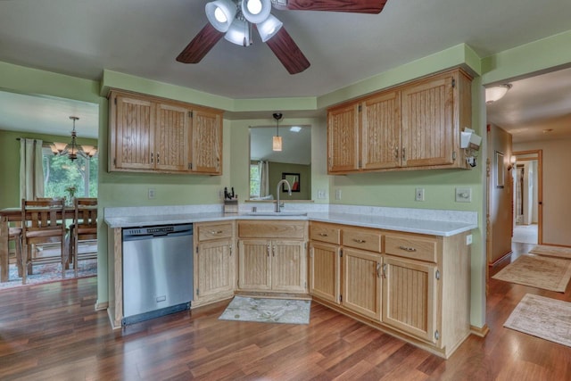 W227N2527 Meadowood Ln, Waukesha, WI 53186 - kitchen with dishwasher, plenty of natural light, light countertops, and dark wood-style floors