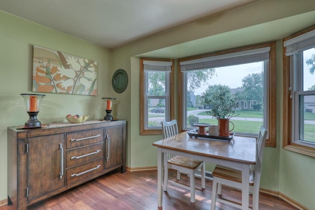 W227N2527 Meadowood Ln, Waukesha, WI 53186 - dining area featuring wood finished floors and healthy amount of natural light