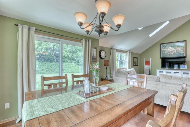 W227N2527 Meadowood Ln, Waukesha, WI 53186 - dining area with a chandelier, a skylight, lofted ceiling, and wood finished floors