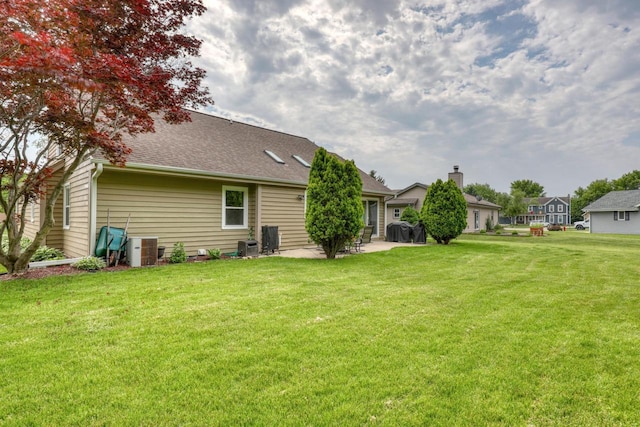 W227N2527 Meadowood Ln, Waukesha, WI 53186 - view of grassy yard with a patio area