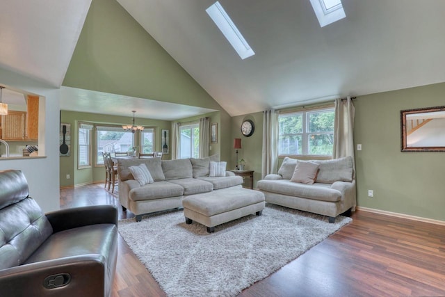 W227N2527 Meadowood Ln, Waukesha, WI 53186 - living area featuring a chandelier, wood finished floors, high vaulted ceiling, and a skylight