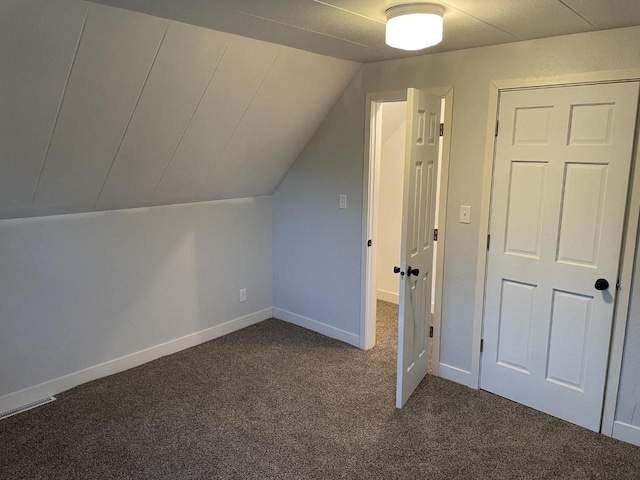 5700 N 60th St, Milwaukee, WI 53218 - bonus room featuring dark carpet and vaulted ceiling
