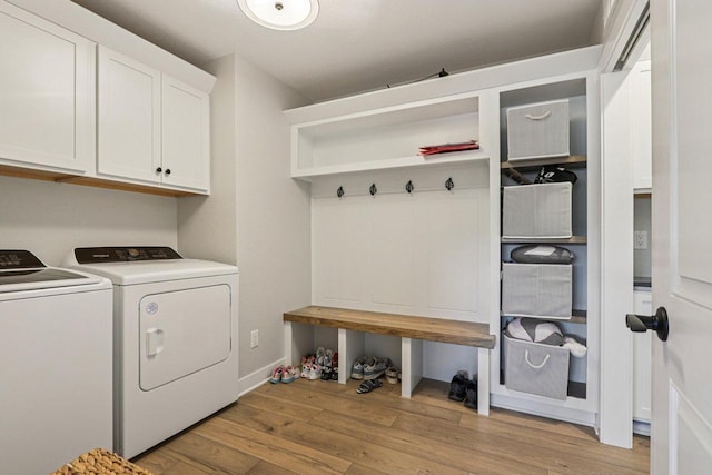 2322 Kae Ct, Mount Pleasant, WI 53406 - laundry room featuring cabinet space, separate washer and dryer, and light wood finished floors