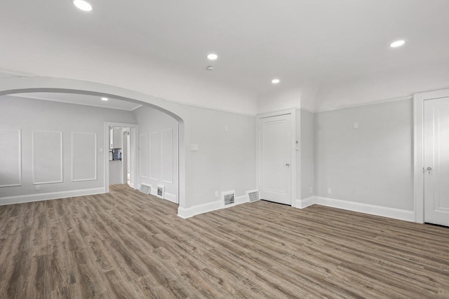 4423 N 30th St Unit 4425, Milwaukee, WI 53209 - unfurnished room featuring recessed lighting, arched walkways, and wood finished floors