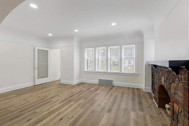 4423 N 30th St Unit 4425, Milwaukee, WI 53209 - unfurnished living room with light wood-style flooring and recessed lighting