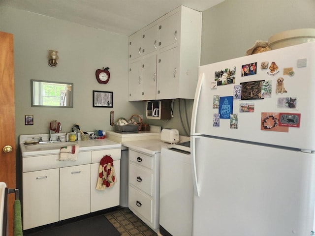 36805 N County Highway J, Bayfield, WI 54814 - kitchen featuring freestanding refrigerator, white cabinets, and light countertops