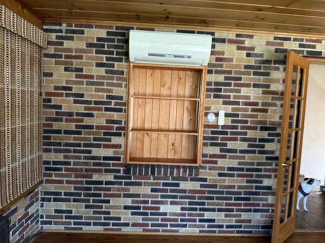 472 Orchard St, Burlington, WI 53105 - detailed view of a wall unit AC and brick wall