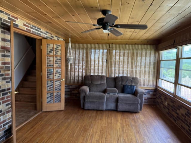 472 Orchard St, Burlington, WI 53105 - living area featuring wooden ceiling, wood finished floors, brick wall, and ceiling fan