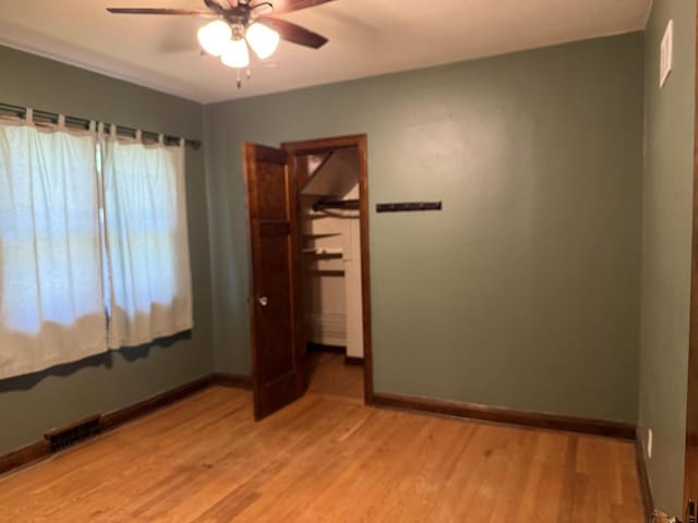 472 Orchard St, Burlington, WI 53105 - unfurnished bedroom featuring light wood-type flooring and a ceiling fan