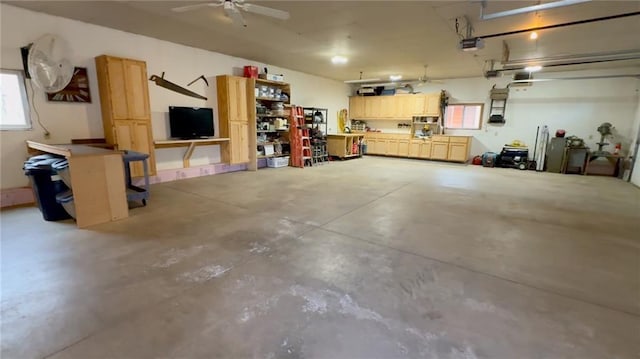 7766 Thunder Point Rd, Hayward, WI 54843 - garage featuring a garage door opener and ceiling fan