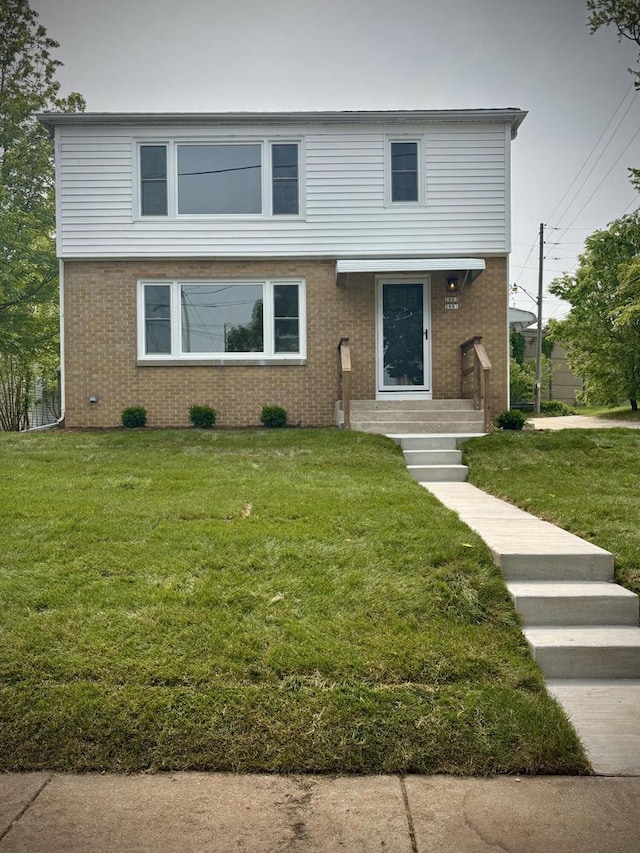 2881 S Linebarger Ter # 2883, Milwaukee, WI 53207 - view of front of home featuring brick siding and a front yard