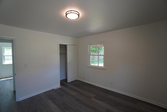 2881 S Linebarger Ter # 2883, Milwaukee, WI 53207 - unfurnished bedroom featuring dark wood-style floors and a closet
