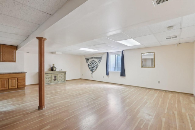 7170 S Countryside Dr, Franklin, WI 53132 - below grade area with a drop ceiling and light wood-style floors