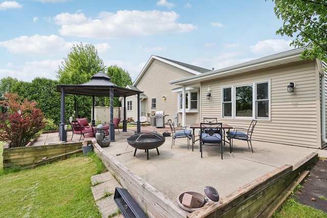 7170 S Countryside Dr, Franklin, WI 53132 - view of patio with a gazebo, an outdoor fire pit, a grill, and outdoor dining space