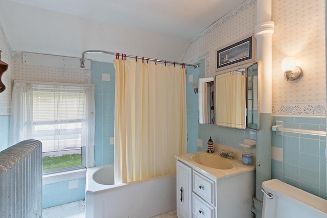 N2485 County Road Ii, Columbus, WI 53925 - full bath with wallpapered walls, radiator, shower / bath combination with curtain, vanity, and tile walls