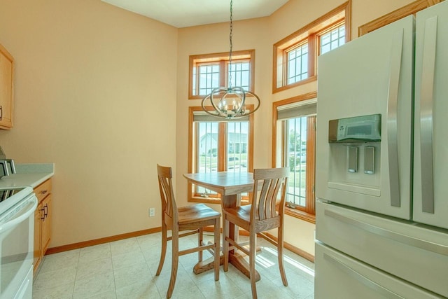 1227 N 3rd St, Monroe, WI 53566 - dining space with a chandelier and baseboards