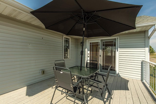 1227 N 3rd St, Monroe, WI 53566 - wooden terrace with outdoor dining area