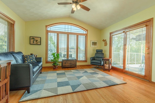 1227 N 3rd St, Monroe, WI 53566 - living area featuring wood finished floors, lofted ceiling, and ceiling fan
