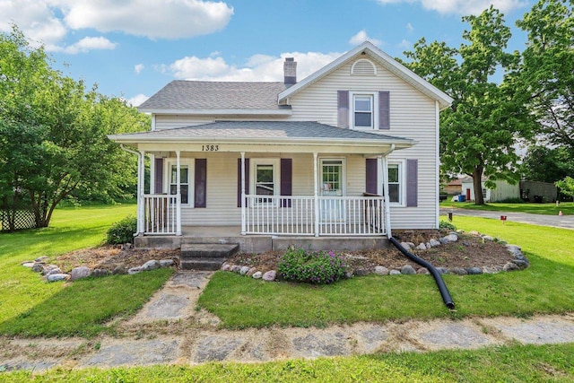 1383 Range Trl, Verona, WI 53593 - view of front of house featuring a porch, a front lawn, a chimney, and a shingled roof