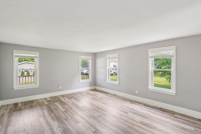 1383 Range Trl, Verona, WI 53593 - empty room featuring light wood finished floors and baseboards