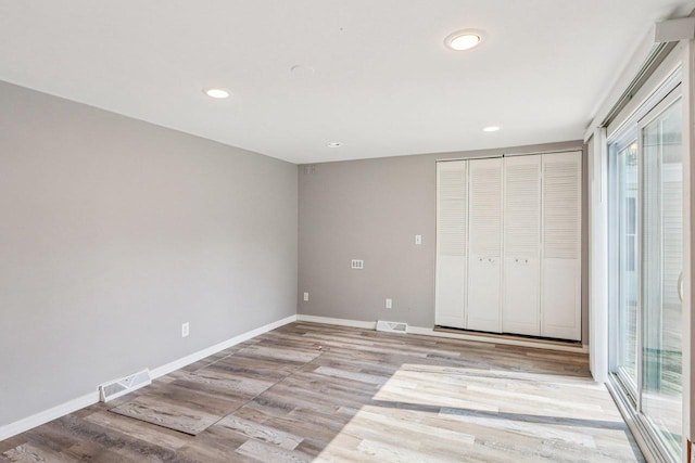 1383 Range Trl, Verona, WI 53593 - unfurnished bedroom with light wood-style flooring, recessed lighting, and a closet