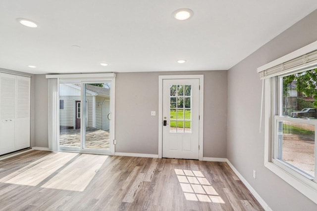 1383 Range Trl, Verona, WI 53593 - doorway with light wood-style flooring and recessed lighting