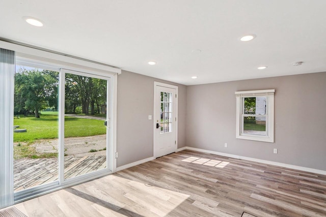 1383 Range Trl, Verona, WI 53593 - empty room with wood finished floors, recessed lighting, and a smoke detector