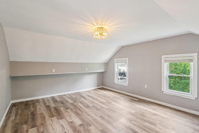 1383 Range Trl, Verona, WI 53593 - bonus room featuring vaulted ceiling, wood finished floors, and a chandelier