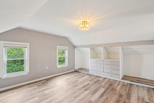 1383 Range Trl, Verona, WI 53593 - additional living space featuring lofted ceiling, light wood finished floors, and a chandelier