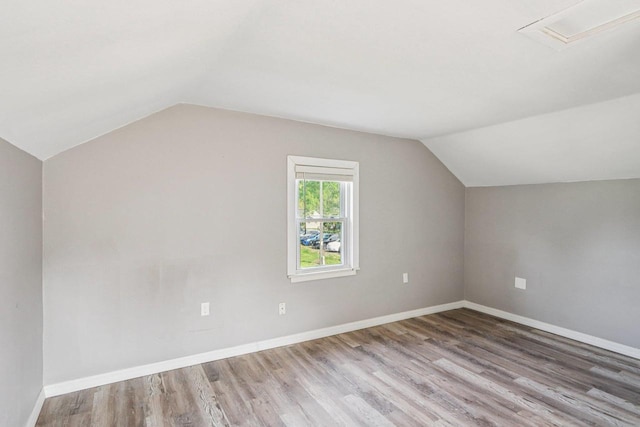 1383 Range Trl, Verona, WI 53593 - additional living space featuring lofted ceiling and wood finished floors