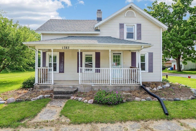 1383 Range Trl, Verona, WI 53593 - view of front of property with a porch, a chimney, a shingled roof, and a front yard