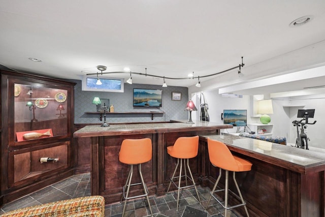 3154 N 82nd St, Milwaukee, WI 53222 - indoor wet bar with dark stone finish flooring