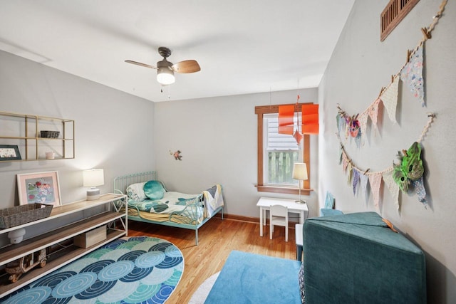 3154 N 82nd St, Milwaukee, WI 53222 - bedroom with wood finished floors and a ceiling fan