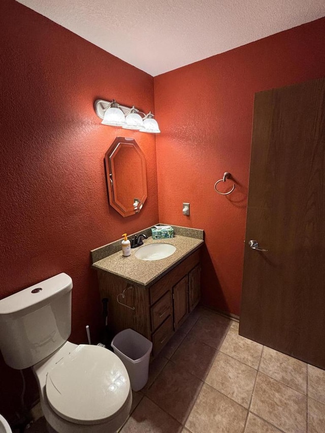 N34W23849 Grace Ave Unit C, Pewaukee, WI 53072 - bathroom featuring a textured wall, vanity, a textured ceiling, and tile patterned floors
