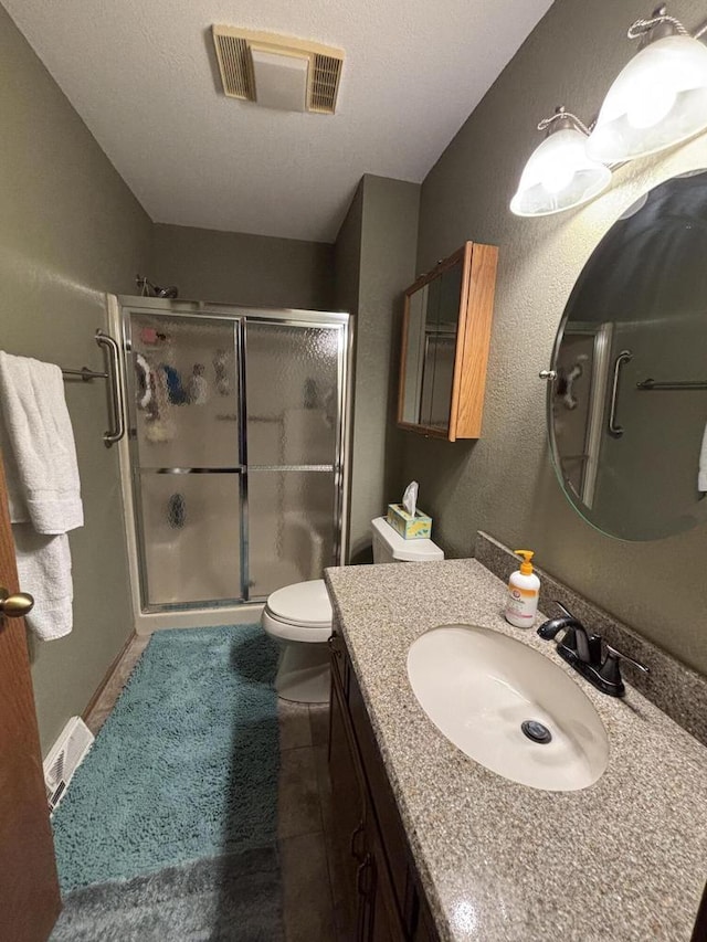 N34W23849 Grace Ave Unit C, Pewaukee, WI 53072 - bathroom with a shower stall, vanity, and tile patterned flooring