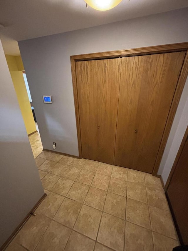 N34W23849 Grace Ave Unit C, Pewaukee, WI 53072 - unfurnished bedroom featuring light tile patterned floors and a closet
