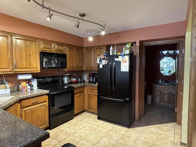 N34W23849 Grace Ave Unit C, Pewaukee, WI 53072 - kitchen featuring black appliances, light tile patterned floors, and brown cabinetry
