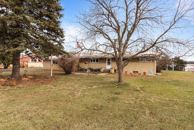 230 Gilbertson St, Markesan, WI 53946 - view of green lawn featuring entry steps