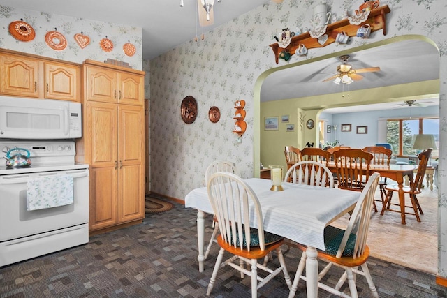 230 Gilbertson St, Markesan, WI 53946 - dining room featuring a ceiling fan, arched walkways, and wallpapered walls