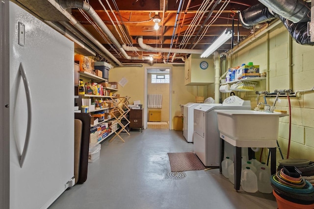 230 Gilbertson St, Markesan, WI 53946 - basement with washer and dryer and freestanding refrigerator