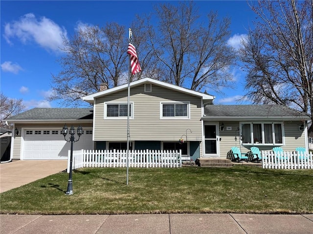 3158 Leslie Ln, Eau Claire, WI 54703 - tri-level home with a garage, concrete driveway, a chimney, and roof with shingles