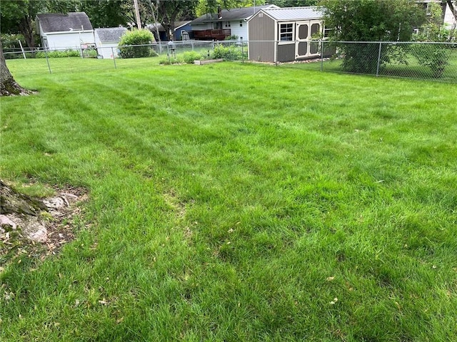 3158 Leslie Ln, Eau Claire, WI 54703 - fenced backyard featuring a storage unit
