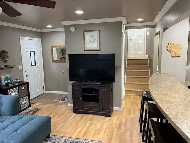 3158 Leslie Ln, Eau Claire, WI 54703 - living room with ceiling fan, crown molding, light wood-style floors, recessed lighting, and stairway