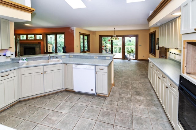 3381 S Highpointe Dr, New Berlin, WI 53151 - kitchen featuring white dishwasher, light countertops, a peninsula, and oven