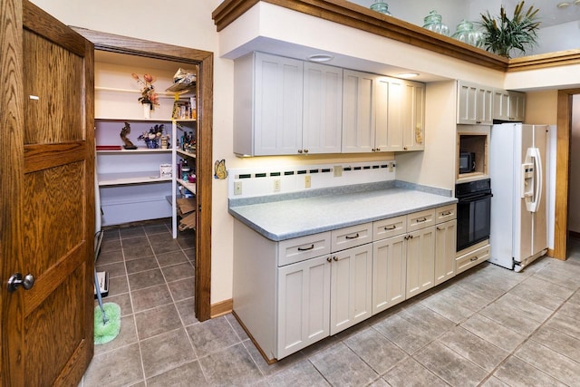 3381 S Highpointe Dr, New Berlin, WI 53151 - kitchen with black appliances, light tile patterned flooring, and light countertops