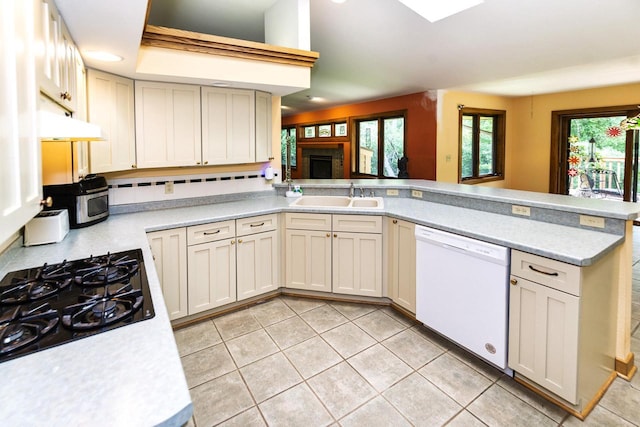3381 S Highpointe Dr, New Berlin, WI 53151 - kitchen with white dishwasher, light countertops, black gas cooktop, and a peninsula