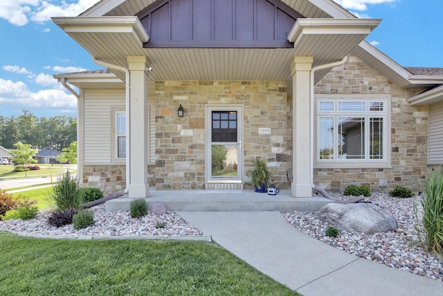 1395 American Eagle Dr, Slinger, WI 53086 - property entrance with stone siding and board and batten siding
